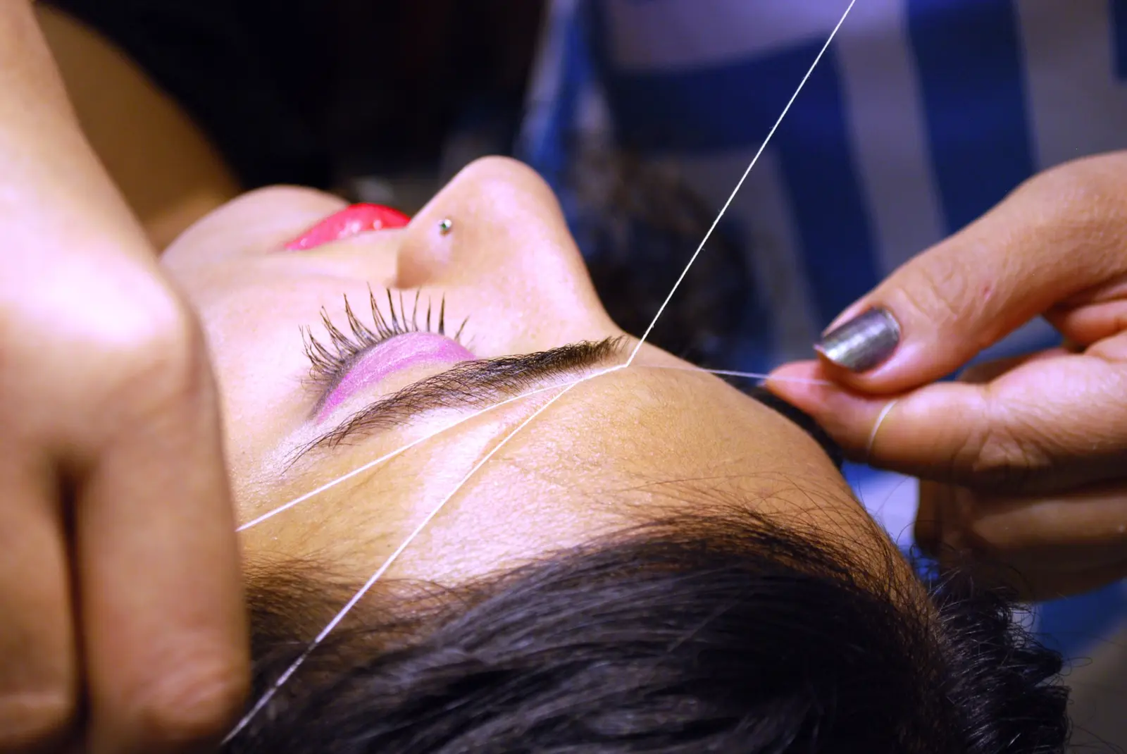 Close view of professional eyebrow threading